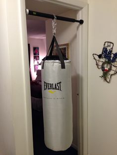 a punching bag hanging from a hook in a hallway