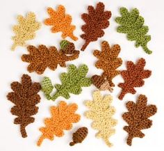 crocheted leaves are arranged in the shape of an acorn and maple leaf