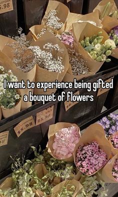 flowers are in brown paper bags with words on them that says i want to experience being gi