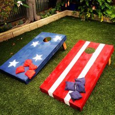 an american flag themed cornhole game set up on the grass with red, white and blue pieces