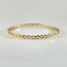 *THIS PIECE IS SOLD BUT CAN BE RE-MADE AS CUSTOM IF ORDERED BY 12/04/24* Cast in 18k yellow gold. This piece has been cast in a sequential oval pattern that is part of the Helios Collection. This beautiful bangle is a series of organic ovals is on the wrist and is wonderful solo or stacking with our other bangles. -18k yellow gold -4.5mm wide - matte finish Available in 18k white, 18k yellow and 18k rose gold inquire for platinum pricing. Most CM pieces can be made to order with alternate gemsto Oval Yellow Gold Bracelets For Everyday, Yellow Gold Oval Bracelets For Everyday Wear, Everyday Oval Yellow Gold Bracelets, Minimalist Yellow Gold Oval Bracelet, Modern Oval Yellow Gold Bangle, Modern Yellow Gold Oval Bangle, Ceremonial Yellow Gold Hallmarked Bangle, Formal Yellow Gold-plated Bangle, Stackable Yellow Gold-plated Bangle