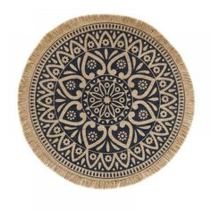 a round rug with an intricate design on it