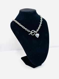 This chain necklace is smashing. Can be worn daily with any kind of outfit. #togglenecklace #lovependant #silvernecklace #giftidea #giftguild #birthdaygiftguild Gift Metal Toggle Necklace With Chunky Chain, Metal Chunky Chain Toggle Necklace Gift, Chunky Chain Toggle Necklace Metal Gift, Silver Toggle Necklace Chain As A Gift, Silver Toggle Necklace With Chain For Gift, Metal Heart Necklace With Chunky Chain, Silver Toggle Necklace With Chain As Gift, Chunky Chain Heart Metal Necklace, Metal Chunky Chain Necklace For Valentine's Day