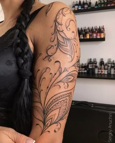 a woman with a tattoo on her arm