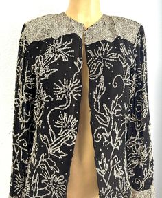 This lace blazer coat is all hand beaded with sequins perfect for parties and special events. Elegant Embellished Festive Outerwear, Elegant Embellished Fall Outerwear, Elegant Fitted Outerwear For Festive Occasions, Elegant Long Sleeve Blazer For Festive Occasions, Elegant Festive Evening Outerwear, Elegant Fitted Sequin Outerwear, Festive Embellished Evening Blazer, Sequin Wedding Blazer For Winter, Winter Wedding Sequin Blazer