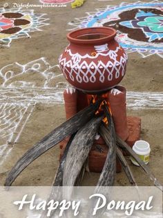 a clay pot sitting on top of a fire pit