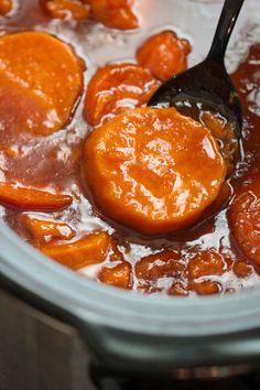 the carrots are being cooked in the slow cooker