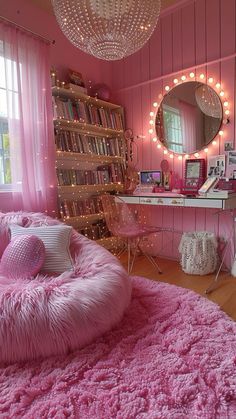 a bedroom with pink walls and lights on the ceiling, a round bed is in front of a large mirror