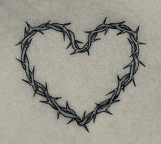 a heart made out of barbed wire