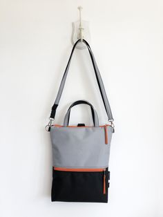 "Convertible customizable water resistant minimal slim fit backpack DETAILS - outer zippered pocket front and back - 4 inside open pockets - inside zipper pocket - zipper closure - metal parts nickel - double hand strap: optional (20\" long on the pictures) MATERIALS and other customization - in the pictures: light grey with back and orange zipper, nickel metal parts - outer: optional WATERPROOF CORDURA fabric (100%PES) - internal: beige canvas - optional metal hardwer - optional zipper colors T Practical Everyday Backpack With Ykk Zipper, Modern Backpack With Zipper Closure And Double Handle, Practical Backpack For Everyday Use, Modern Backpack With Zipper Pocket For Outdoor, Functional Everyday Backpack With Ykk Zipper, Zipper Closure Shoulder Backpack Bag, Modern Rectangular Backpack With Zipper Closure, Modern Rectangular Backpack With Ykk Zipper, Multicolor Standard Backpack With Zipper Closure