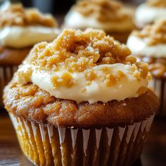 cupcakes with white frosting and crumbs on top