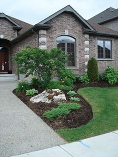 a house with landscaping in front of it