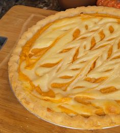 a pie sitting on top of a wooden cutting board