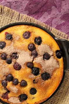 a blueberry cobbler in a cast iron skillet