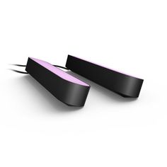 two black and pink curved objects on a white surface