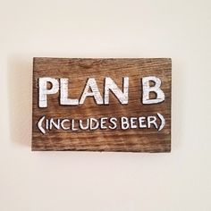 a wooden sign that says plan b includes beer