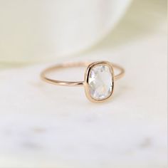 Paloma is a dainty beautiful add to our Demi-Fine & Dainty collection. This minimalistic design is easy to pair with nesting rings for different looks! #rings #rosegold #rectanglecushion #rosecut #moissanite #dainty #minimalist #bezel #solitaire #unique #modern #jewelry #gifts Timeless Rectangular Jewelry With Rose Cut Diamonds, 14k Gold Jewelry With Rectangular Rose Cut Diamonds, Elegant Rose Cut Square Diamonds Jewelry, 14k Gold Rectangular Rose Cut Diamond Rings, Elegant Rectangular Ring With Rose Cut Diamonds, Elegant Rectangular Rings With Rose Cut Diamonds, Elegant Rectangular Rose Cut Diamond Rings, Nesting Rings, Rectangle Cushion