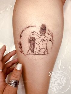 a woman's arm with a tattoo on it