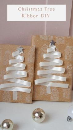 christmas tree ribbon diy is displayed in front of two boxes with ornaments on them