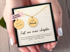 two personalized disc necklaces are shown in a box with the words just one more clumper on it