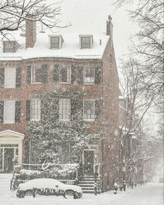 a large red brick building covered in snow