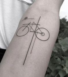 a person with a bike tattoo on their arm