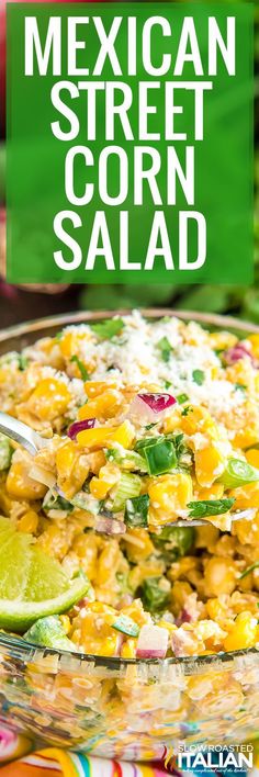 mexican street corn salad in a glass bowl with limes and cilantro on the side