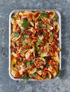 the cover of magazine chicken tiki nachos with an image of pasta in a casserole dish