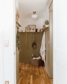 the hallway is clean and ready to be used as a place for hanging things on the wall