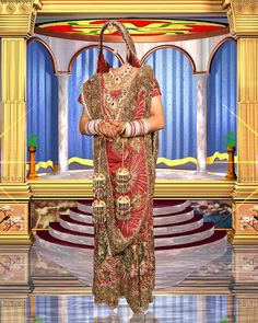 a woman in a red and gold dress standing next to a stage