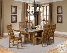 a dining room table with chairs and a chandelier