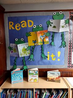 the bookshelf is full of children's books and there are posters on the wall