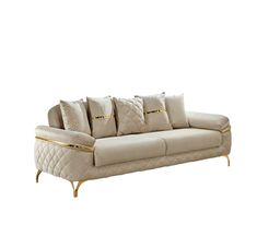 a white couch with gold trimmings and pillows on top of it's back