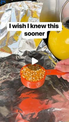 someone is cooking beans in a red skillet on tin foil with the words, i wish i knew this soner