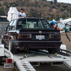 a car is being towed on a trailer