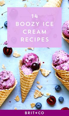 three ice cream cones with blueberries and cherries in them on top of a table