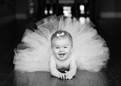 the baby is wearing a blue tutu and posing for a photo on instagram