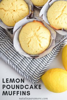 lemon pound cake muffins are sitting on a towel next to some lemons