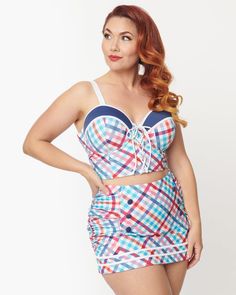 This gorgeous swim top features a stunning pastel madras plaid print that will turn heads at the pool or beach. The lace-up front adds a flirty touch while providing adjustable coverage to suit your style and comfort. With molded cups and underwire support, you'll feel confident and secure all day long. Plus, the side boning ensures a flattering fit that accentuates your curves in all the right places. Putting it on is a breeze thanks to the convenient back hook closure and adjustable straps. This plus-size tankini top is a sleek staple from our size-inclusive swimwear collection. Unique Vintage Unique Vintage Pastel Madras Plaid Lace Up Swim Top | Pastel Madras Plaid | Swimsuits | Materials & Care Instructions: ['82% Nylon, 18% Spandex', 'Hand wash', 'Imported'] Inclusive Swimwear, Plus Size Tankini, Swimsuit Material, Madras Plaid, Plus Size Swim, Swim Bottoms, Swimwear Collection, Plaid Print, Tankini Top