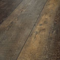 an old wood floor is shown in this close up shot, with the grained surface visible