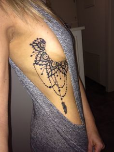 a woman with a tattoo on her shoulder