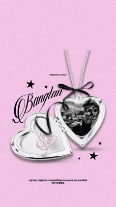 two heart shaped ornaments hanging from a string on a pink background with the words batman