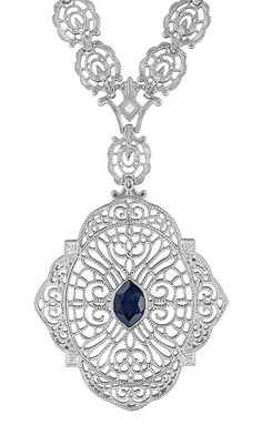 Edwardian Filigree Sapphire and Diamond Drop Pendant Necklace in Sterling Silver $490.00 http://www.antiquejewelrymall.com/n152s.html Elegant Sapphire Jewelry With Intricate Design, Oval Diamond Filigree Necklace, Classic Pendant Necklace With Filigree, White Gold Filigree Necklace In Oval Shape, White Gold Oval Filigree Necklace, Oval White Gold Filigree Necklace, Art Deco Diamond Necklace With Filigree Details, Art Deco Diamond Necklace With Filigree, Exquisite Silver Sapphire Necklaces