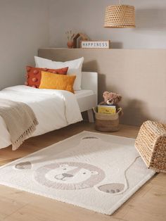 a bedroom with a teddy bear rug on the floor