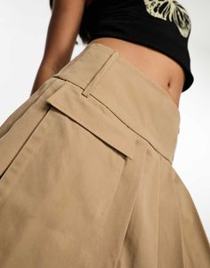 Skirts by KYO Lower-half looks Regular rise Belt loops Pocket detail Back zip closure Regular fit High Waist Brown Skort With Pockets, Beige Skort With Pockets For Work, Beige High-waist Mini Skirt With Pockets, Beige High Waist Mini Skirt With Pockets, High-waist Khaki Mini Skirt With Pockets, High Waist Khaki Mini Skirt With Pockets, Khaki Wide Leg Skirt With Pockets, Chic Beige Skort With Pockets, Beige Mini Skirt With Pockets