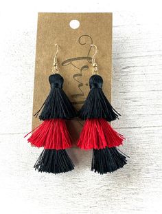 Be sure to check our shop announcements for any current sales or coupon codes!  All discount information will be posted there.  The perfect game day earring DOES exist  Colors- red, black  Length- Approx. 3" Back- Fish hook back Metal hardware color- gold Nickel and lead compliant FINAL SALE- please check dimensions and details before purchasing, just to ensure these will work for you! Details~Policies~The fine print. :)  I want you to LOVE your purchase!!  If you have any questions, please just Black Drop Tassel Earrings As Gift, School Spirit Earrings, The Fine Print, Color Earrings, Red Team, Perfect Game, Fine Print, Loose Stones, Work For You