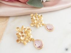 "These beautiful hydrangea flower earrings are the perfect accessory for the Spring and Summer. They feature gold plated flowers with pretty light pink stones. Treat yourself or someone special with these gold statement earrings.  Your order will come in an exquisite white packaging box with a satin ribbon ready for gifting. 💖 Perfectly packaged for: - birthday gift - mother's day gift - bridal shower gift - Christmas gift - Valentine's Day Gift Details : ----------- - gold plated flower with s Gift For Plant Lover, White Packaging, Flower Earrings Gold, Pink Stones, San Ramon, Stones Jewelry, Flower Packaging, Gold Statement Earrings, Mother Birthday Gifts