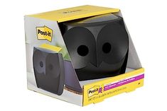 an open box with two black speakers in it