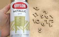 a can of krylon metallic gold next to numbers