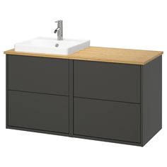 a bathroom vanity with two drawers and a white sink on the top, next to a wooden countertop